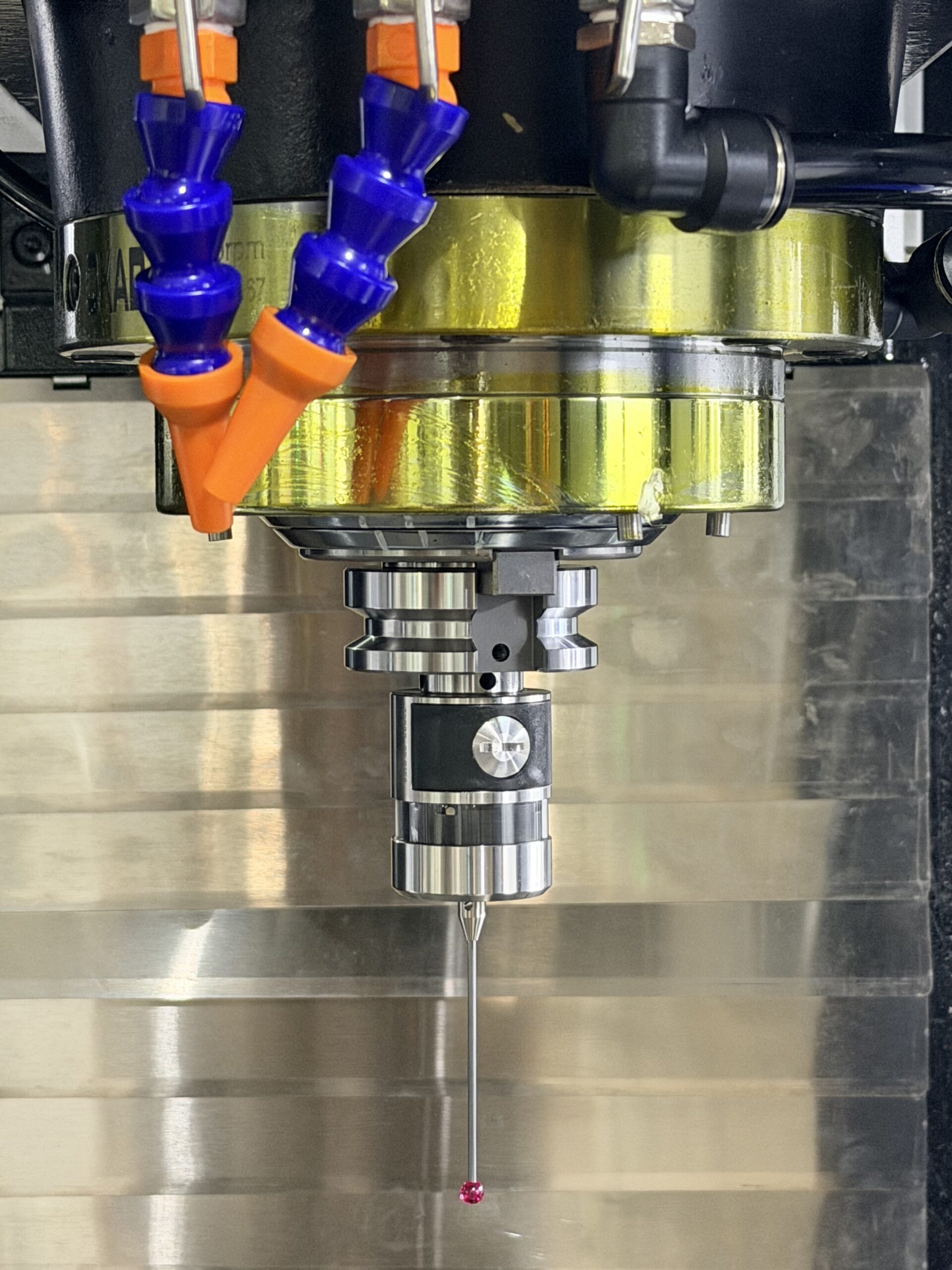 CNC touch probe assembly showing the mounting shank, probe body, and ruby-tipped stylus