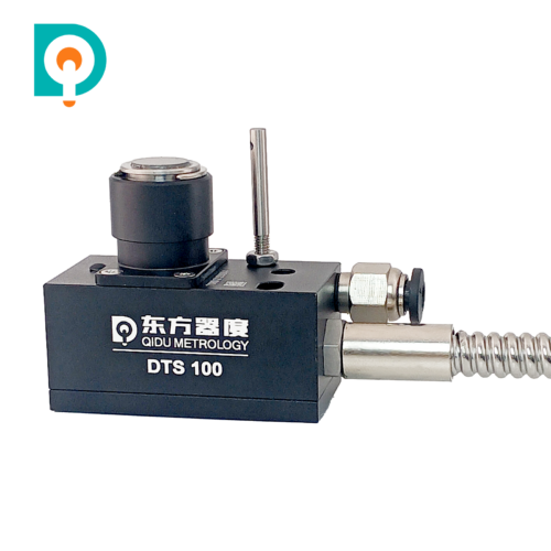DTS100 Z-axis CNC contact tool setter with black housing, circular touch pad, coiled cable and flexible metal protective conduit.